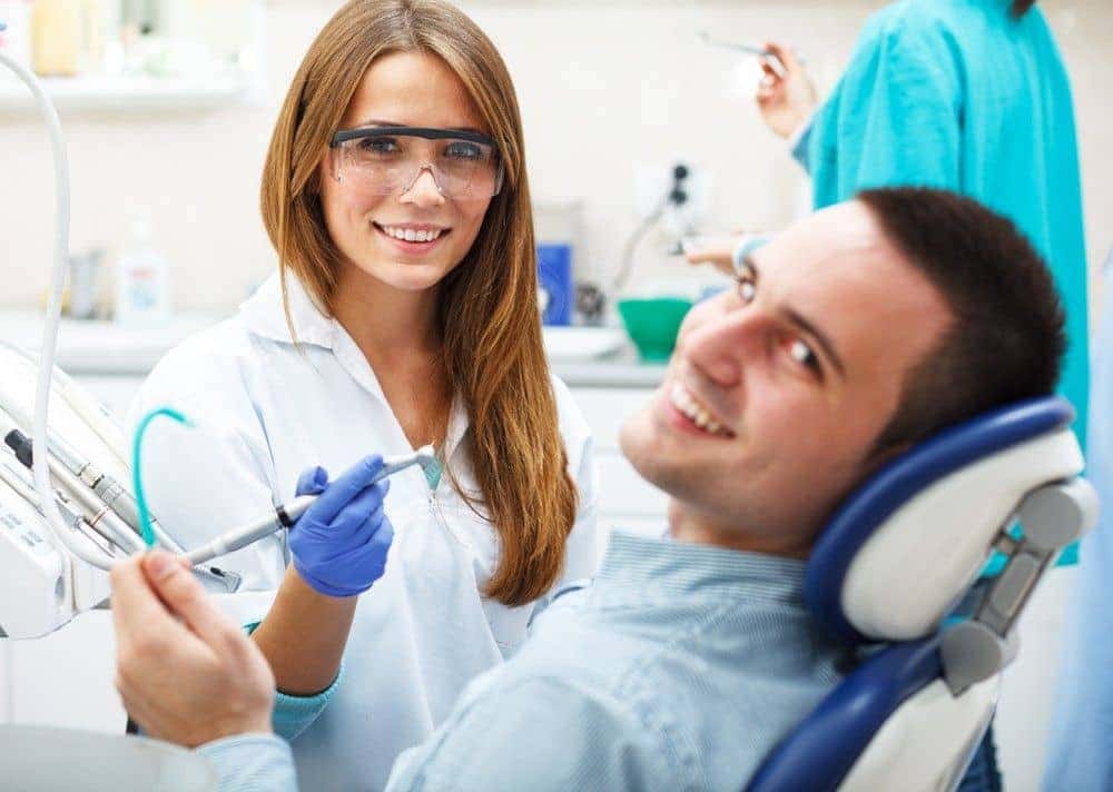 Happy dental patient during fluoride treatment in Long Beach, CA