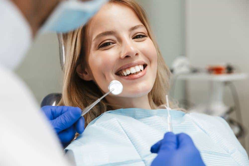 A satisfied patient undergoes white fillings treatment in Long Beach, CA